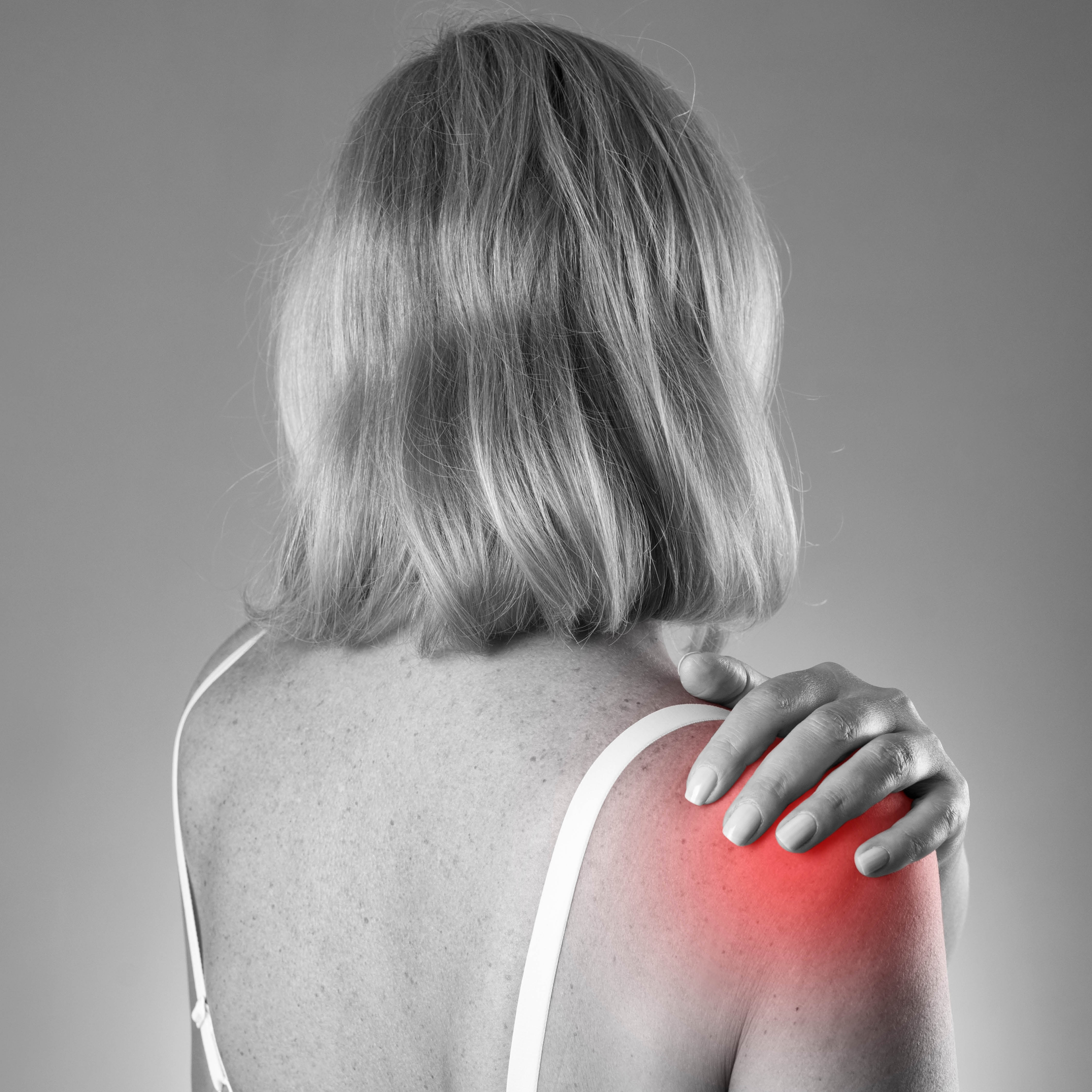 Woman experiencing shoulder pain